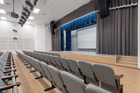 Empty auditorium. Conference room interior with a stage and chairsの写真素材