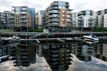 Houses reflexed in the water and private pier