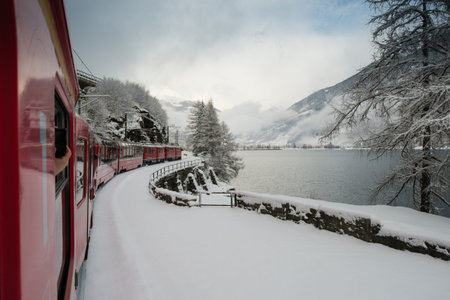 LE PRESE, SWITZERLAND - January, 2018. The Poschiavo lake seen from the Bernina Express train,  in...