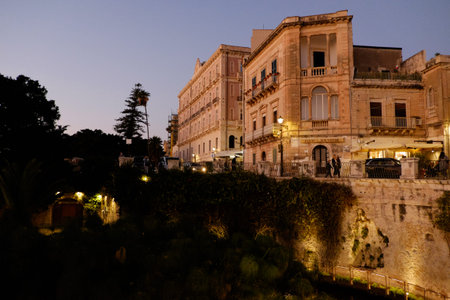 Syracuse, Italy - October, 2020. Magnificent view of the island of Ortigia at sunsetの写真素材