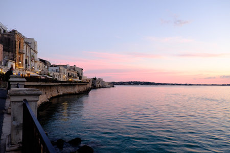 Syracuse, Italy - October, 2020. Magnificent view of the island of Ortigia at sunsetの写真素材