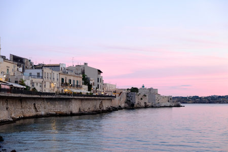 Syracuse, Italy - October, 2020. Magnificent view of the island of Ortigia at sunsetの写真素材