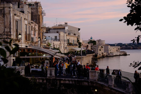 Syracuse, Italy - October, 2020. Magnificent view of the island of Ortigia at sunsetの写真素材