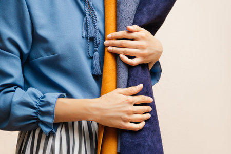 Close-up of multicolored leather rolls in womens hands