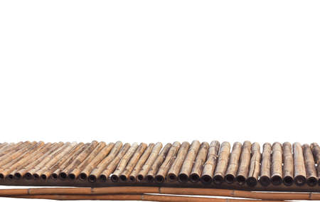 The old bamboo walkway is in the countryside with no balcony to prevent accidents on a white background.の写真素材