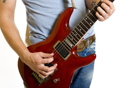 Close up of an electric guitar being played