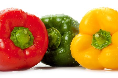 picture of three colored bell peppers with water droplets onの写真素材