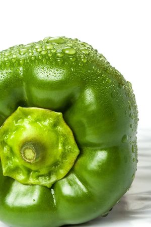 green pepper isolated on white with water drops onの写真素材