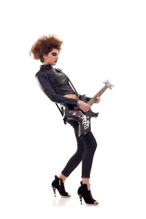 Portrait of a beautiful stylish woman with electric guitarの写真素材