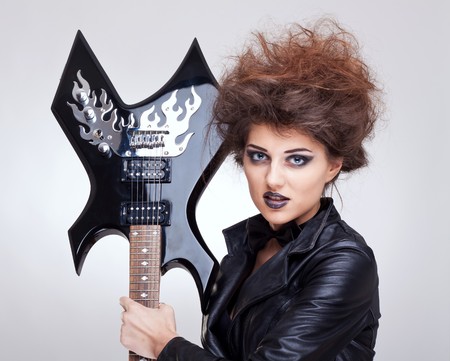 picture of a woman with great makeup holding an electric guitarの写真素材
