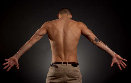 Artistic portrait of young male on a dark backgroundの写真素材