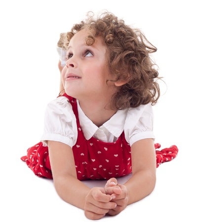Charming blonde girl in elegant red dress looking up, isolatedの写真素材
