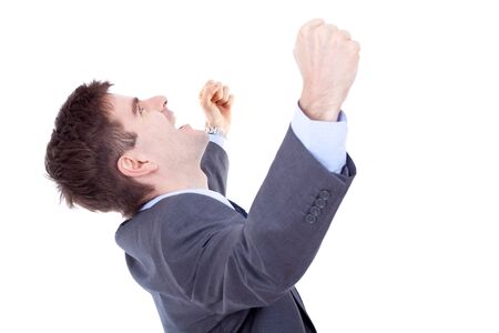 Portrait of young business man shouting loudly with his arms widened の写真素材