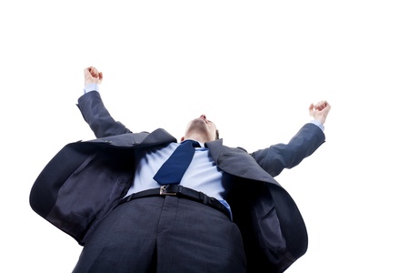 Very happy successful gesturing business man, isolated on white, view from belowの写真素材