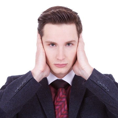 young business man with the hear no evil gesture on white backgroundの写真素材