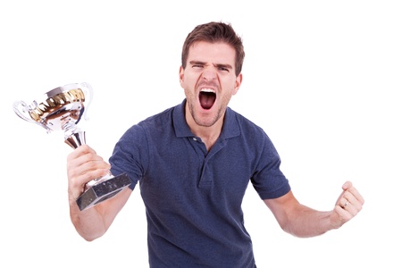 scream of victory of a young casual man winning a trophy, on white backgroundの写真素材