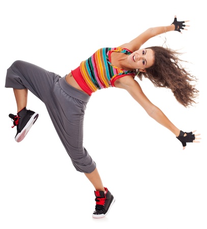 Beautiful woman dancer in hip hop attire striking a pose isolated on white background Beautiful woman dancer in hip hop attire striking a pose isolated on white background