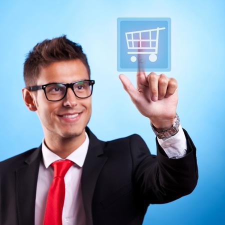 Business man pressing a shopping type of modern button
の写真素材