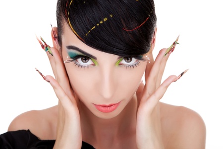 Close-up of an attractive woman holding her fingers in her ears and watching the camera. Isolated on white background.の写真素材