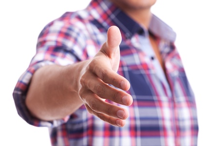 A casual young man is offering to shake hand on white の写真素材