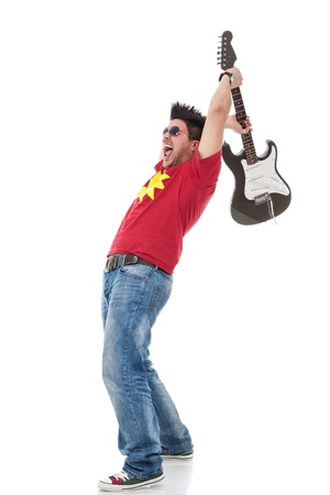 young casual man shouting and preparing to smash his electric guitar on white backgroundの写真素材
