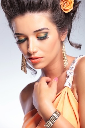 closeup of a young fashion woman looking down. の写真素材