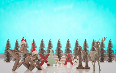 montage of christmas decoration against blue sky like backgroundの写真素材