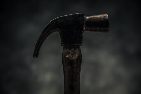 concept of carpentry illustrated by close up picture of hammer for craftsmanship and wood handwork