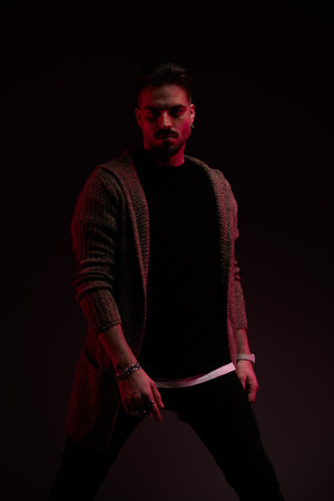 Portrait of sexy fashion model with tough vibe posing, standing, in a fashion poseの写真素材