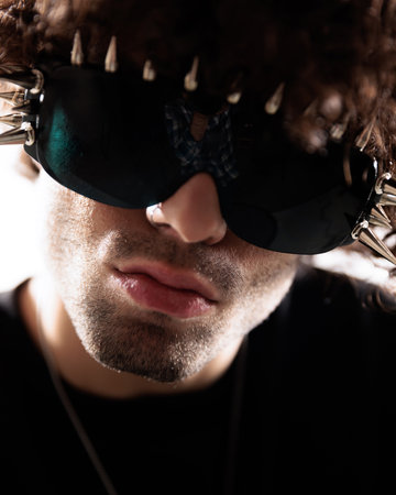 cutout picture of curly hair guy with glasses looking forward and posing in front of white background in studioの写真素材