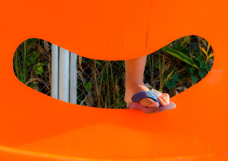 Child leg on play orangeの写真素材