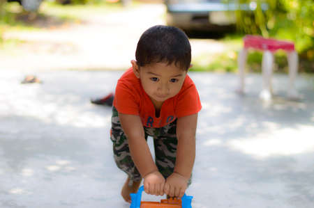 Boy and the amusement at homeの写真素材