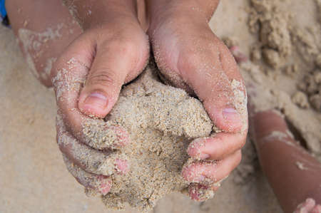 Hand and the sandの写真素材