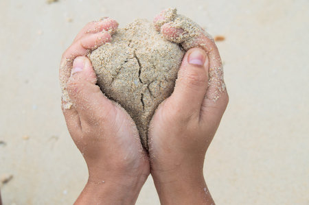 hand and the sand in the morning