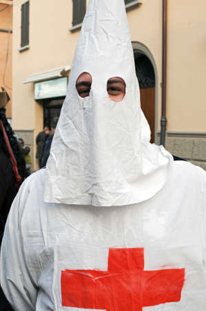 A man dressing the kkk robe A man dressing the kkk robe