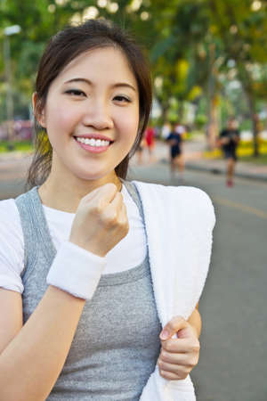 Happy woman showing a fistの写真素材