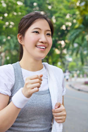 Woman running in the parkの写真素材