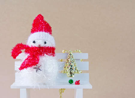 Snowman on the white chair の写真素材
