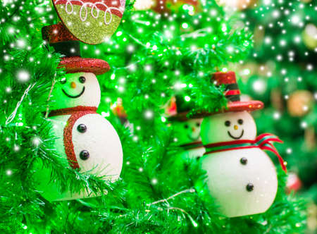 Snoman on christmas treeの写真素材