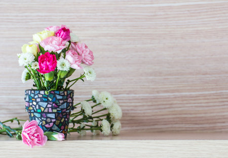 Carnation in mosaic flower pot 