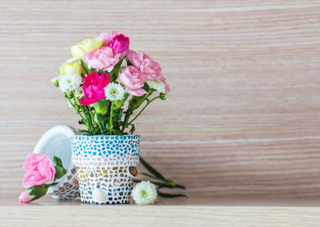 Carnation in mosaic flower pot の写真素材