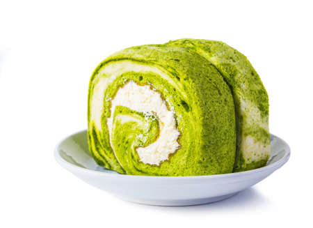 Green tea roll cake on white backgroundの写真素材