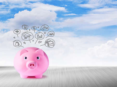 Pink piggy bank and icons design to represent the concept of saving money の写真素材