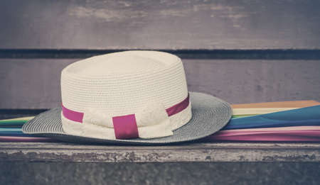 Hat and umbrella on the wooden chair. vintage styleの写真素材