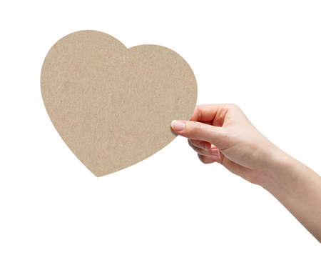 Hand picking brown paper heartの写真素材