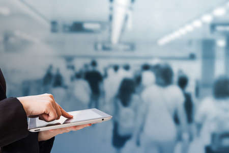 Businesswoman using digital tablet in the subway stationの写真素材