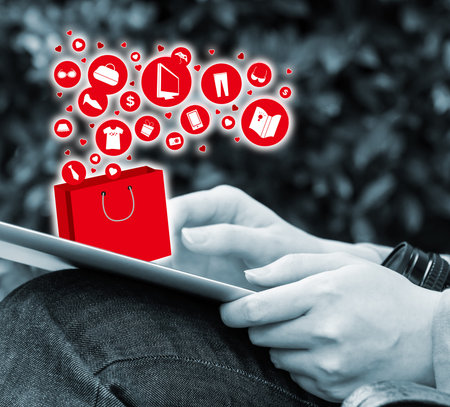 Young woman shopping online by using digital tablet