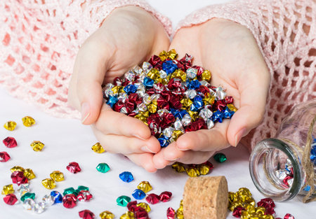 Woman hands holding origami stars