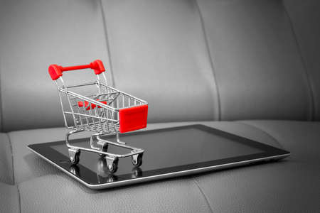Shopping cart on digital tablet. Shopping online concept.の写真素材