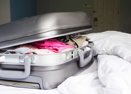 Luggage on the bedの写真素材